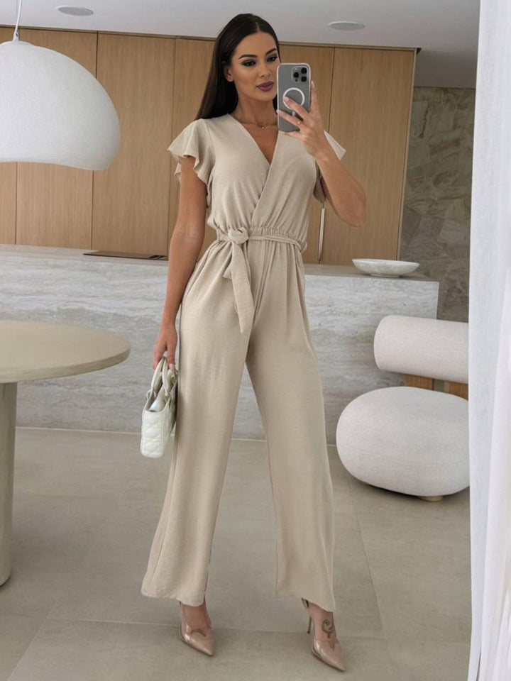 Rochelle Combinaison Femme – Élégante Combinaison Unie avec Décolleté en V, Ceinture & Jambes Amples à Volants